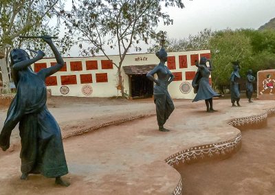 The Art Village Shilpgram with bronze dancers cast from studio Sukriti in Jaipur